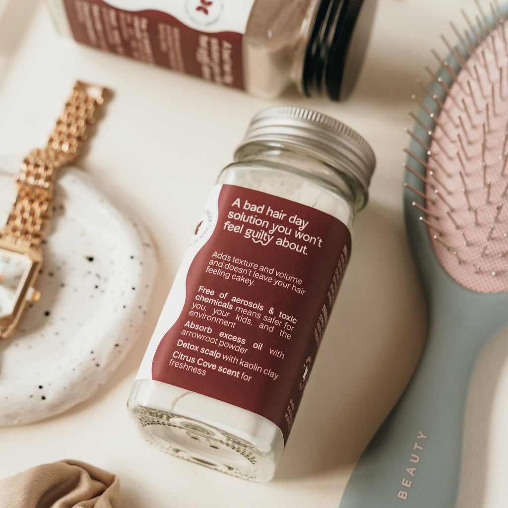 Mira Motte Dry shampoo powder on a surface with hair care items
