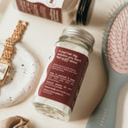 Mira Motte Dry shampoo powder on a surface with hair care items