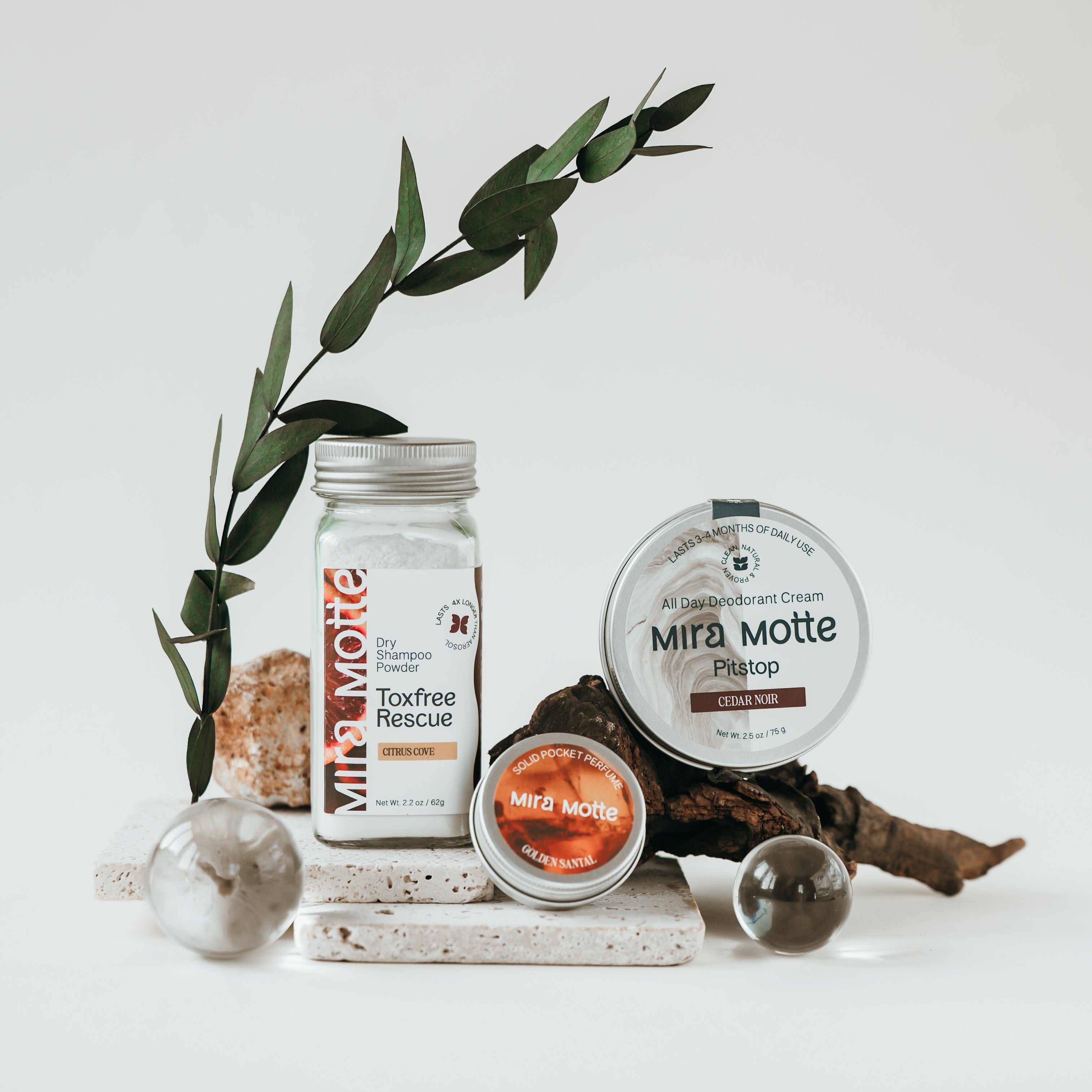 Mira Motte skincare products on a white surface with greenery